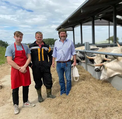 Jan Leo And Dom In Front Of Cattle Barn